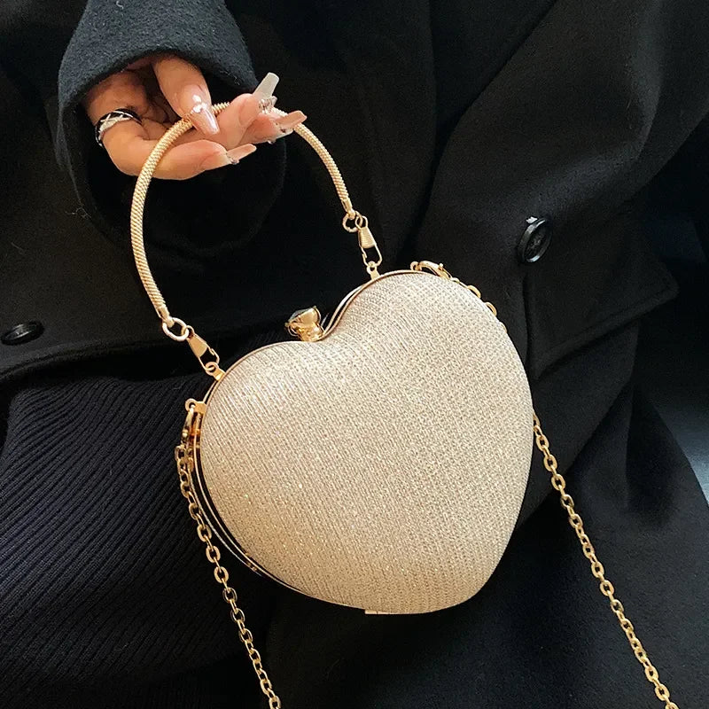 Lady Glams: Heart-Shaped Metal Clutch Bag in Shimmering Elegance